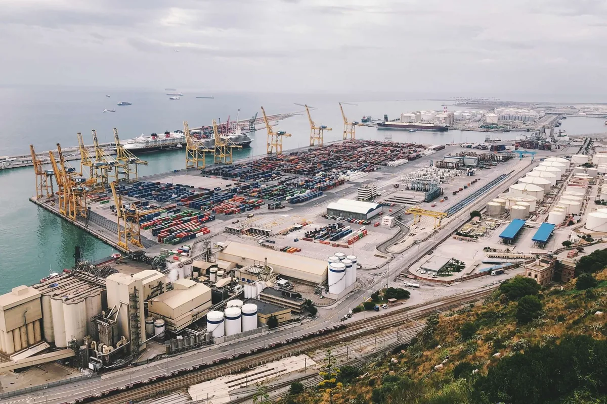 Aerial view of a waterfront cargo port and container terminal