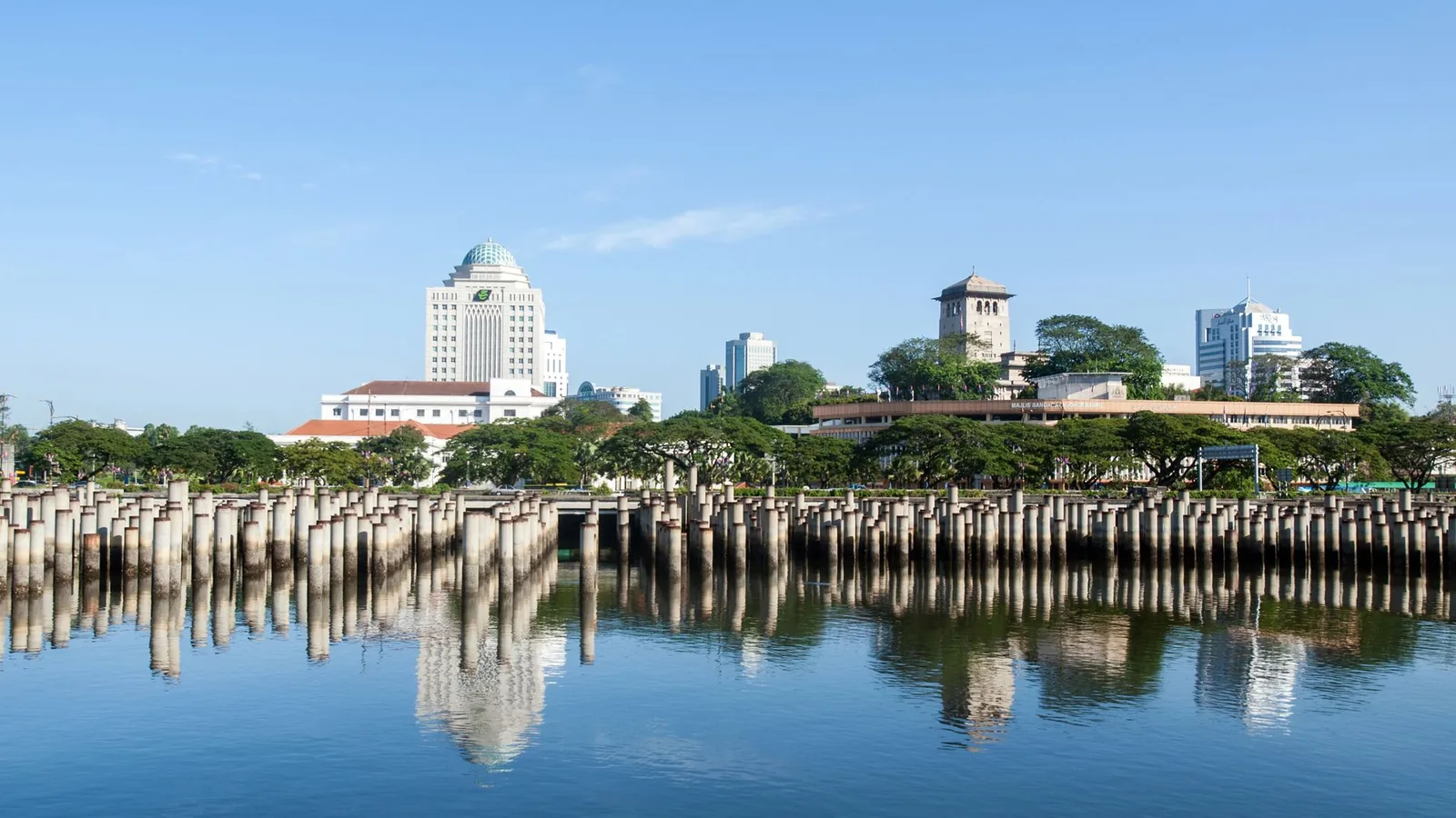 Johor Bahru skyline reflected in the waterfront on a clear day