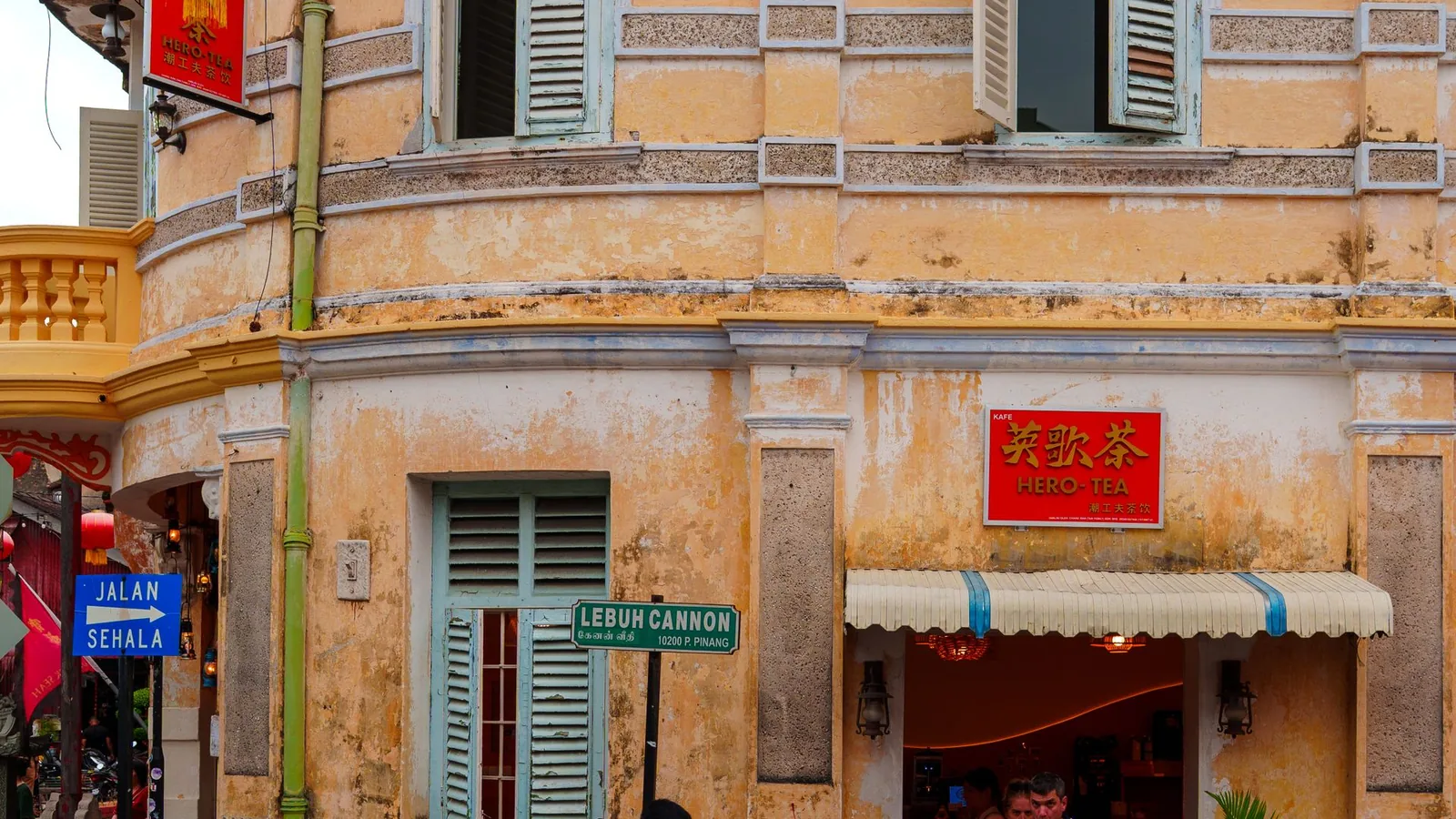 Heritage shophouse facade and street signs in George Town Penang